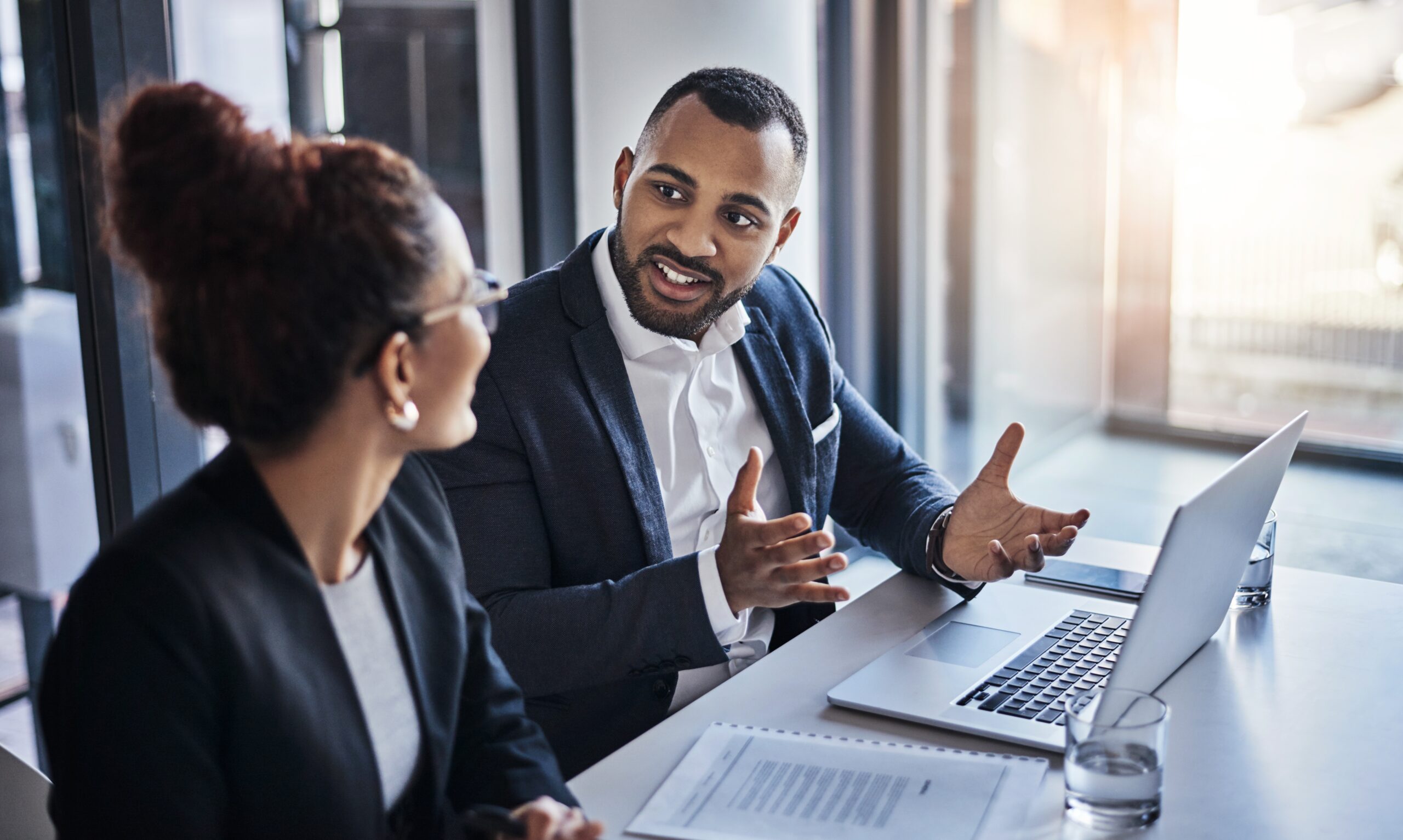 Two people discussing employee performance